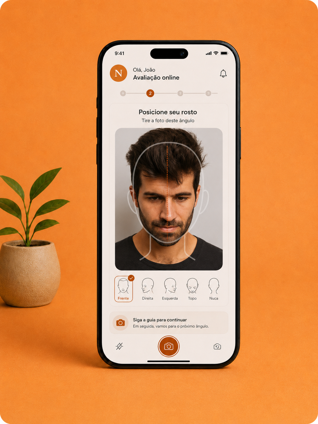 Celular exibindo a captura guiada de fotos para avaliação capilar da NOMA